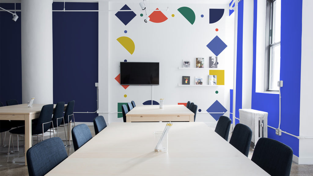 An colorful meeting room with the colored shapes on the wall