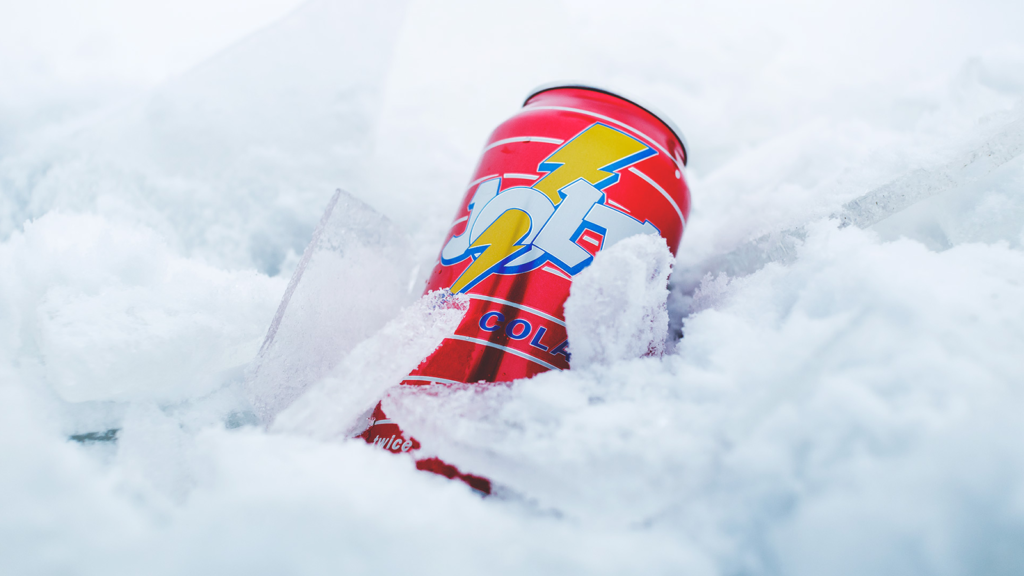 A can of Jolt Cola placed in snow and ice