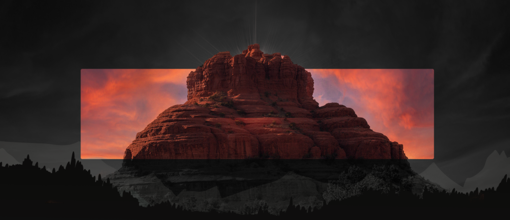 A colored picture of a red-rock butte superimposed over the black and white picture
