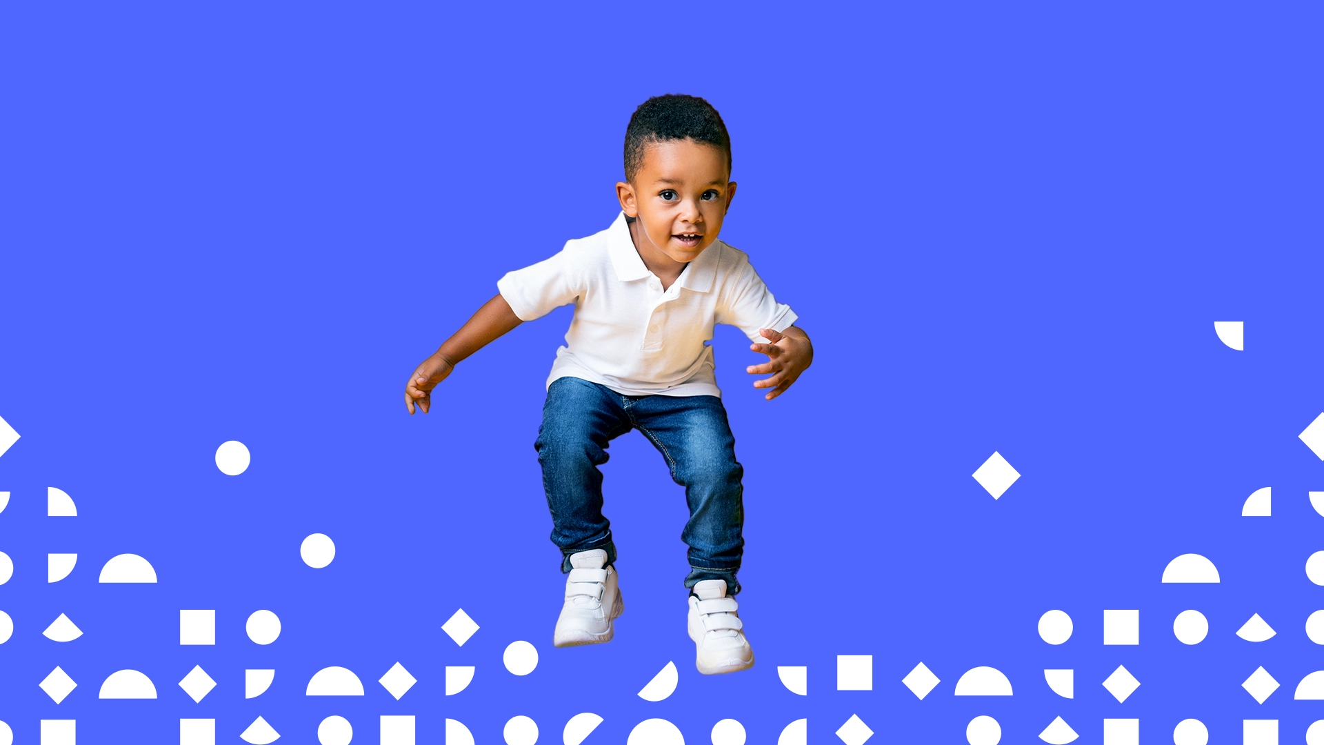 A young boy in a white polo shirt and blue jeans jumps with a playful expression against a solid blue background. Geometric shapes in white, including circles, squares, and triangles, decorate the bottom of the image, reflecting the joyous and vital spirit supported by early-childhood advocacy from First Five Years Fund (FFYF).